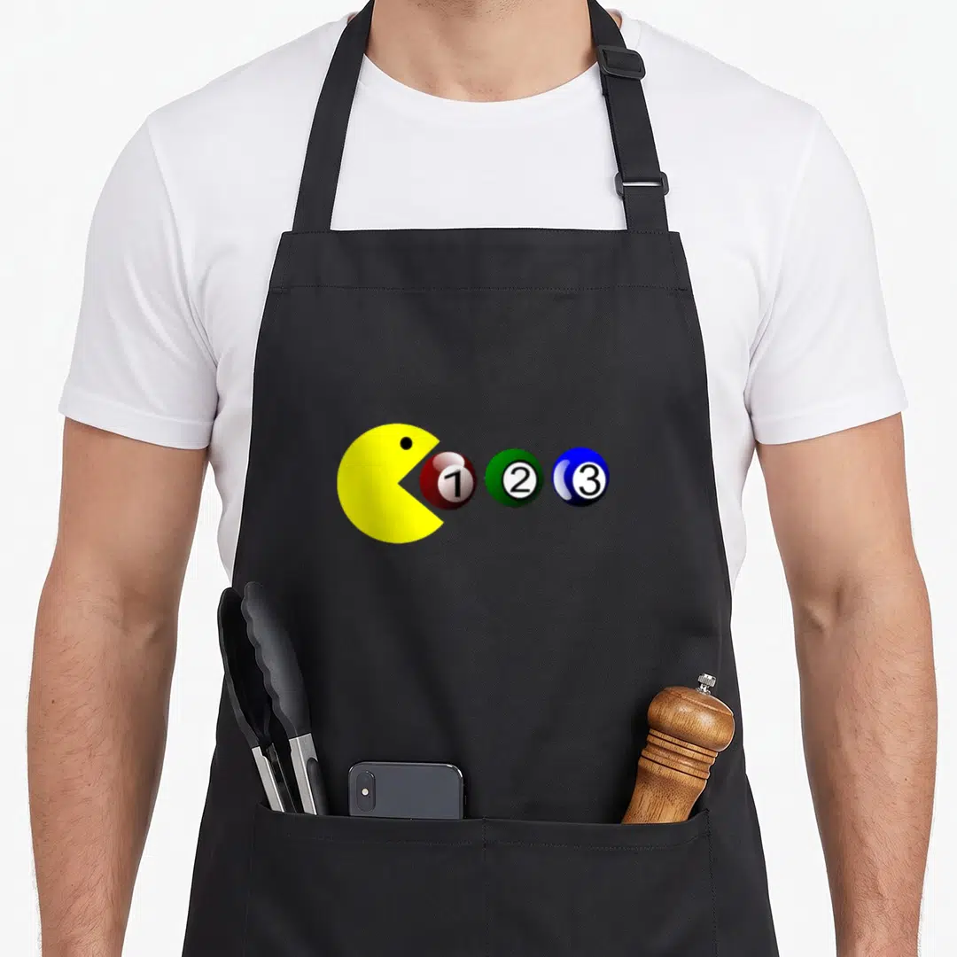 Ball player billiards apron - Yellow Pac-Man facing red 1, green 2, blue 3 billiard balls in cartoon style — shown on a black cotton canvas apron against a white background