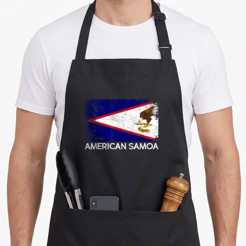 Samoan american flag apron - Distressed American Samoa flag with eagle and text on front panel — shown on a black cotton canvas apron against a white background