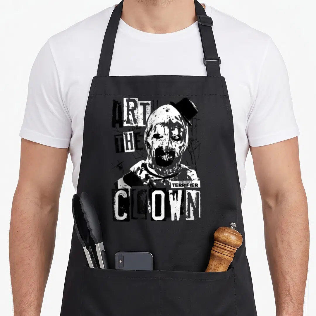 Terrifier bloody apron - Distressed black and white clown portrait with Art The Clown text — shown on a black cotton canvas apron against a white background