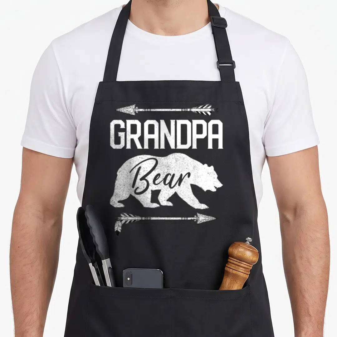 Grandpa bear father day apron - White distressed bear silhouette with GRANDPA text and arrows — shown on a black cotton canvas apron against a white background