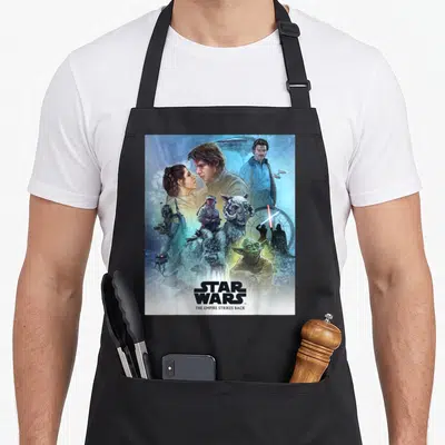 Mural celebration apron - Realistic Star Wars The Empire Strikes Back character montage in blue and grey tones — shown on a black cotton canvas apron against a white background