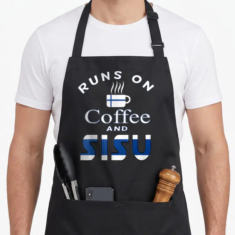 Sisu coffee apron - White cup with blue Finnish flag and text Runs on Coffee And Sisu — shown on a black cotton canvas apron against a white background