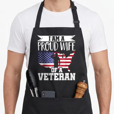 Scare patriotic apron - Distressed USA map with red white blue stripes stars and saluting soldier silhouette surrounded — shown on a black cotton canvas apron against a white background