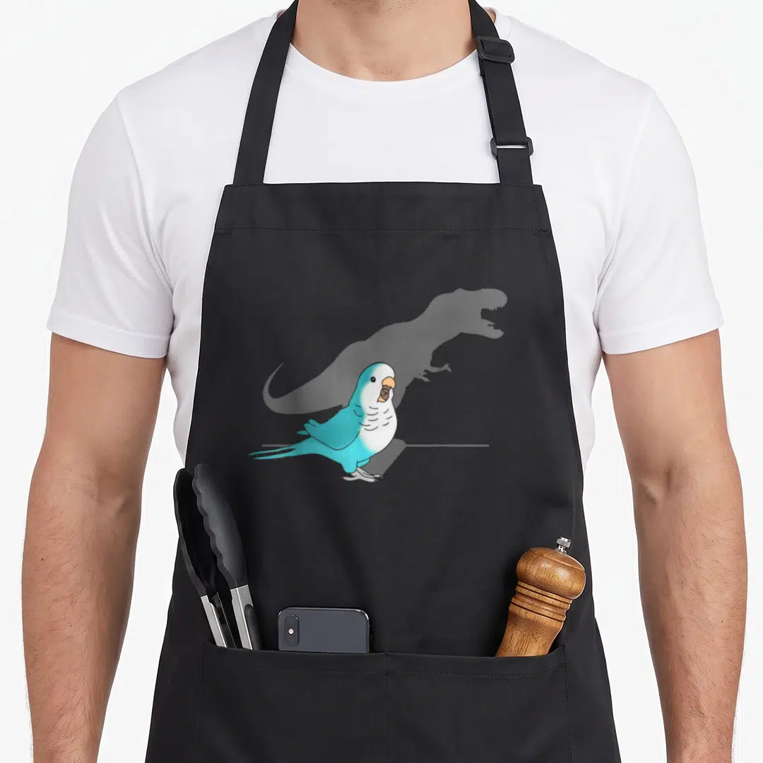 Blue meme apron - Screaming blue parrot with large grey T-Rex shadow cast behind it — shown on a black cotton canvas apron against a white background