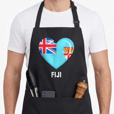 Jersey fiji apron - Heart shape filled with Fiji flag colors above white FIJI text — shown on a black cotton canvas apron against a white background