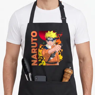 Elemental character aprons - Ninja holding a kunai with vertical NARUTO text and swirl patterns — shown on a black cotton canvas apron against a white background