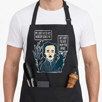 Allan gothic apron - Cartoon Edgar Allan Poe with raven and speech bubble pun on dead trees — shown on a black cotton canvas apron against a white background