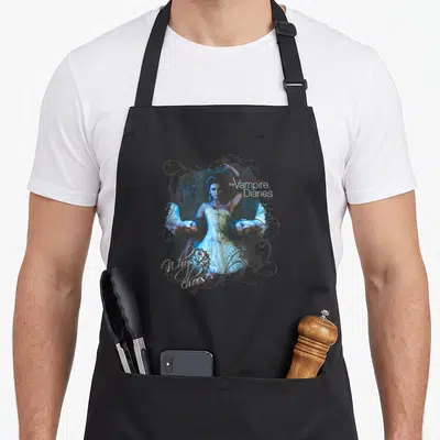 Choose vampire apron - Woman flanked by two men faces with Vampire Diaries Why choose text and grey swirls — shown on a black cotton canvas apron against a white background