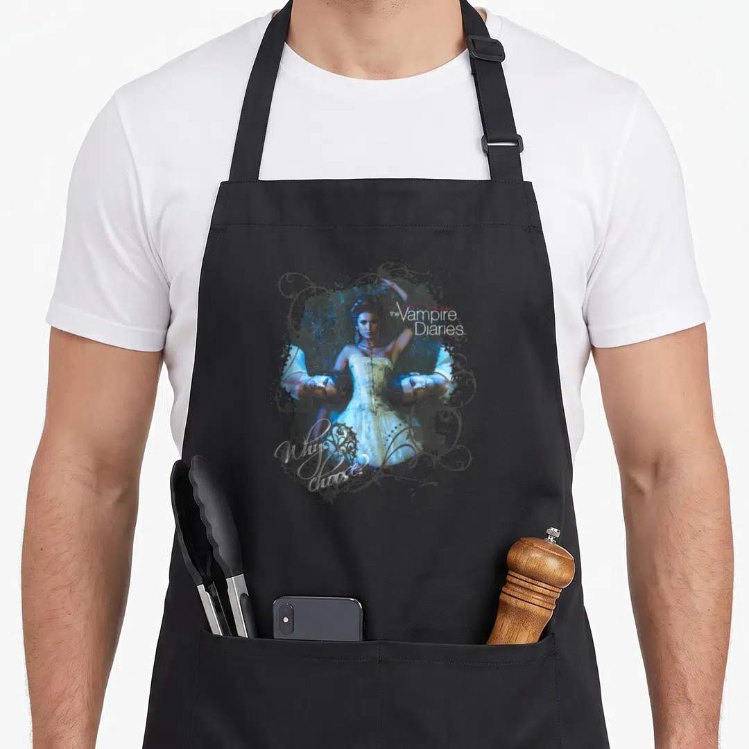 Choose vampire apron - Woman flanked by two men faces with Vampire Diaries Why choose text and grey swirls — shown on a black cotton canvas apron against a white background