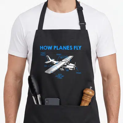 Private engineer apron - White airplane diagram with blue arrows pointing to parts labeled air and magic — shown on a black cotton canvas apron against a white background