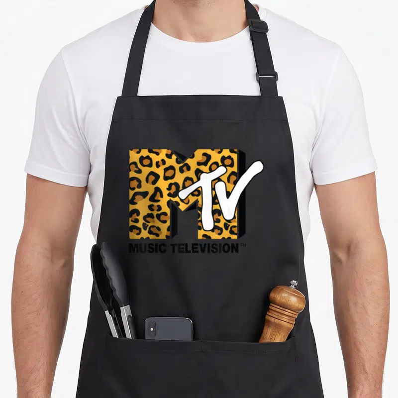 Vintage mtv leopard print apron - MTV logo with orange leopard print fill and white script letters above black text — shown on a black cotton canvas apron against a white background