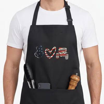 Support jeep apron - Distressed peace sign, striped heart, and off-road vehicle in red white and blue — shown on a black cotton canvas apron against a white background