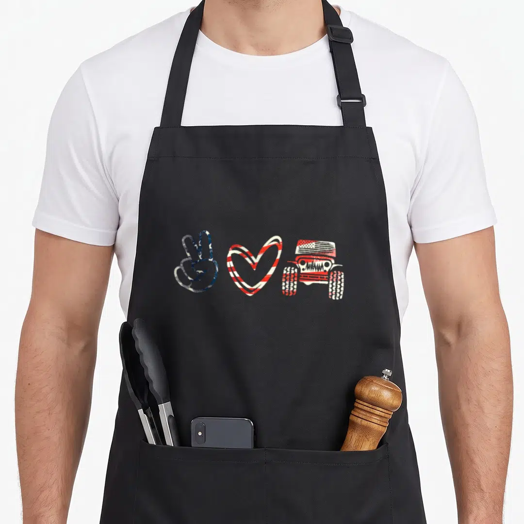 Support jeep apron - Distressed peace sign, striped heart, and off-road vehicle in red white and blue — shown on a black cotton canvas apron against a white background