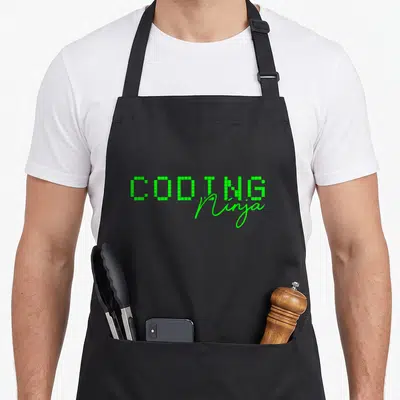 Coding geek apron - Green pixelated CODING text overlapped by cursive Ninja script — shown on a black cotton canvas apron against a white background