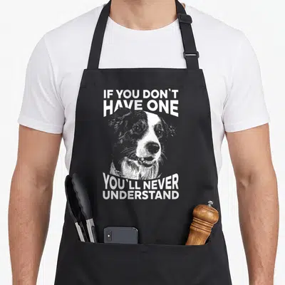 Cute border collie apron - White distressed dog portrait with IF YOU DON'T HAVE ONE YOU'LL NEVER UNDERSTAND text — shown on a black cotton canvas apron against a white background
