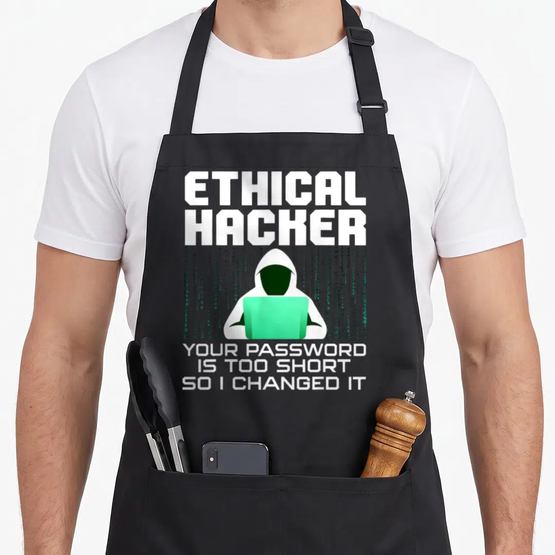Hacking nerd apron - Ethical Hacker text and hooded figure with green laptop and binary code — shown on a black cotton canvas apron against a white background