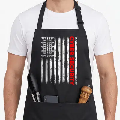 Engineer american flag apron - Vertical distressed flag with white stripes, red CYBER SECURITY text, and shield icons — shown on a black cotton canvas apron against a white background