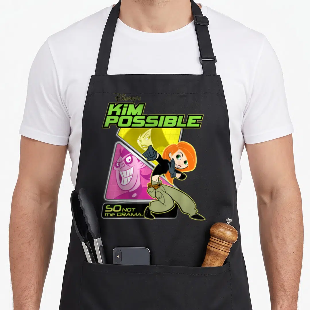 Kim lady comfort apron - Stacked Kim Possible typography with So Not The Drama text below — shown on a black cotton canvas apron against a white background