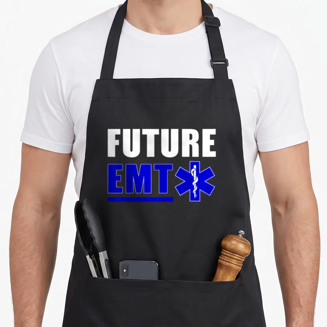 Future paramedic apron - White FUTURE text above blue EMT and Star of Life symbol — shown on a black cotton canvas apron against a white background