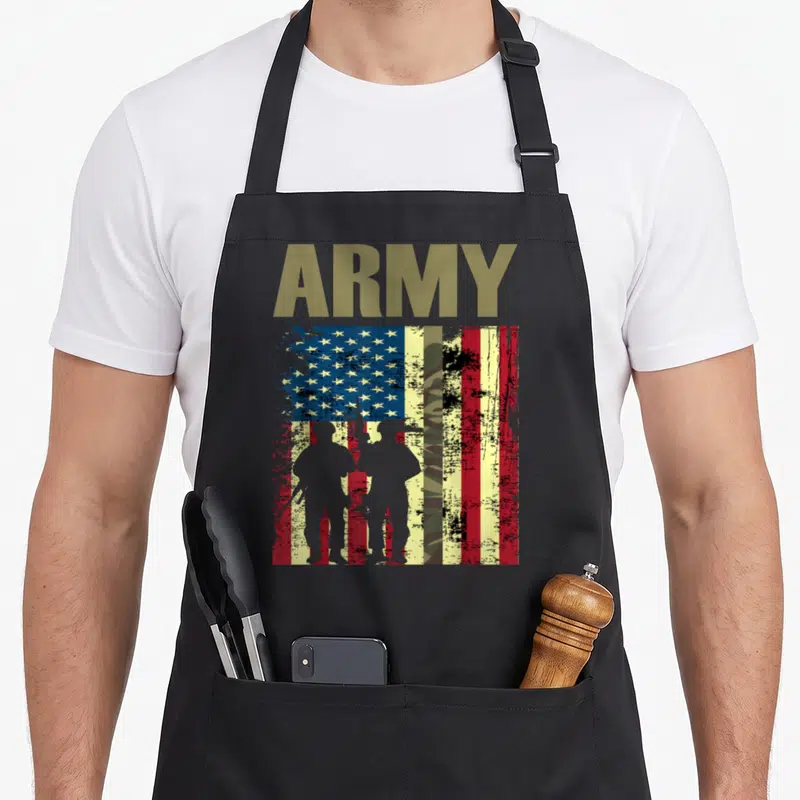 Army camo aprons - Distressed USA flag with ARMY text, two soldier silhouettes, and central camo stripe in olive grey — shown on a black cotton canvas apron against a white background