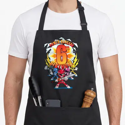 6th action birthday apron - Power Rangers 6th Birthday cartoon with five rangers and arched text — shown on a black cotton canvas apron against a white background