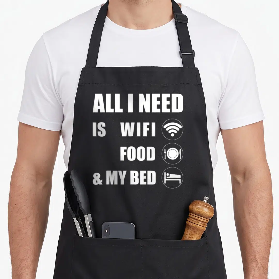 Wifi food aprons - ALL I NEED IS WIFI FOOD & MY BED text with wifi plate bed icons — shown on a black cotton canvas apron against a white background