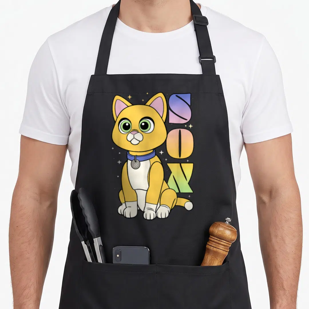 Lightyear cat apron - Cartoon orange cat sitting next to vertical gradient SOX text with stars — shown on a black cotton canvas apron against a white background