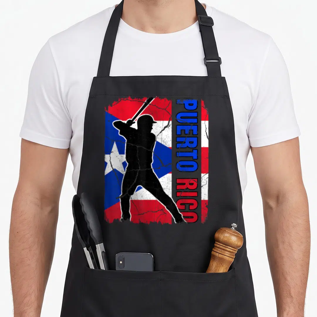 Rican baseball apron - Black batter silhouette over distressed red white and blue flag with vertical Puerto Rico text — shown on a black cotton canvas apron against a white background