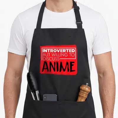 Animation anime apron - Red rectangle with white bordered text Introverted But Willing To Discuss and large black ANIME — shown on a black cotton canvas apron against a white background