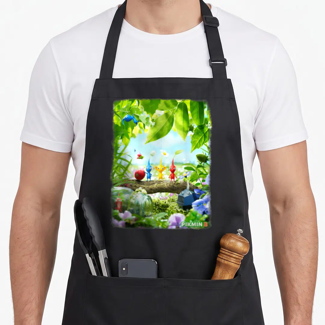 Pikmin tree apron - Four colorful Pikmin on a branch with PIKMIN 3 logo in photo style — shown on a black cotton canvas apron against a white background