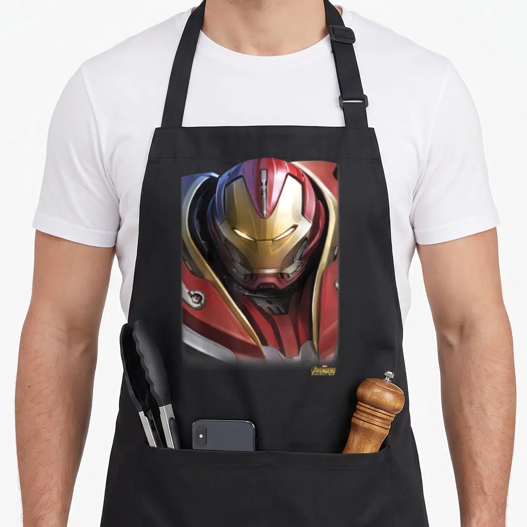 Hulkbuster infinity apron - Realistic Iron Man helmet in red, gold, and silver armor with small logo in corner — shown on a black cotton canvas apron against a white background