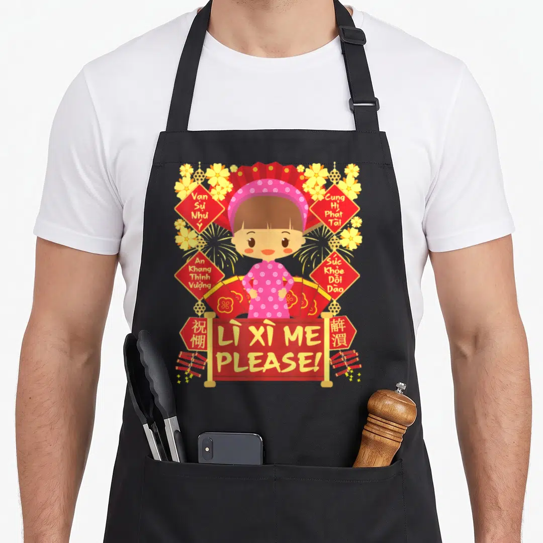 Lunar vietnamese girl apron - Cartoon girl in pink dress surrounded by red diamond signs with Vietnamese text — shown on a black cotton canvas apron against a white background
