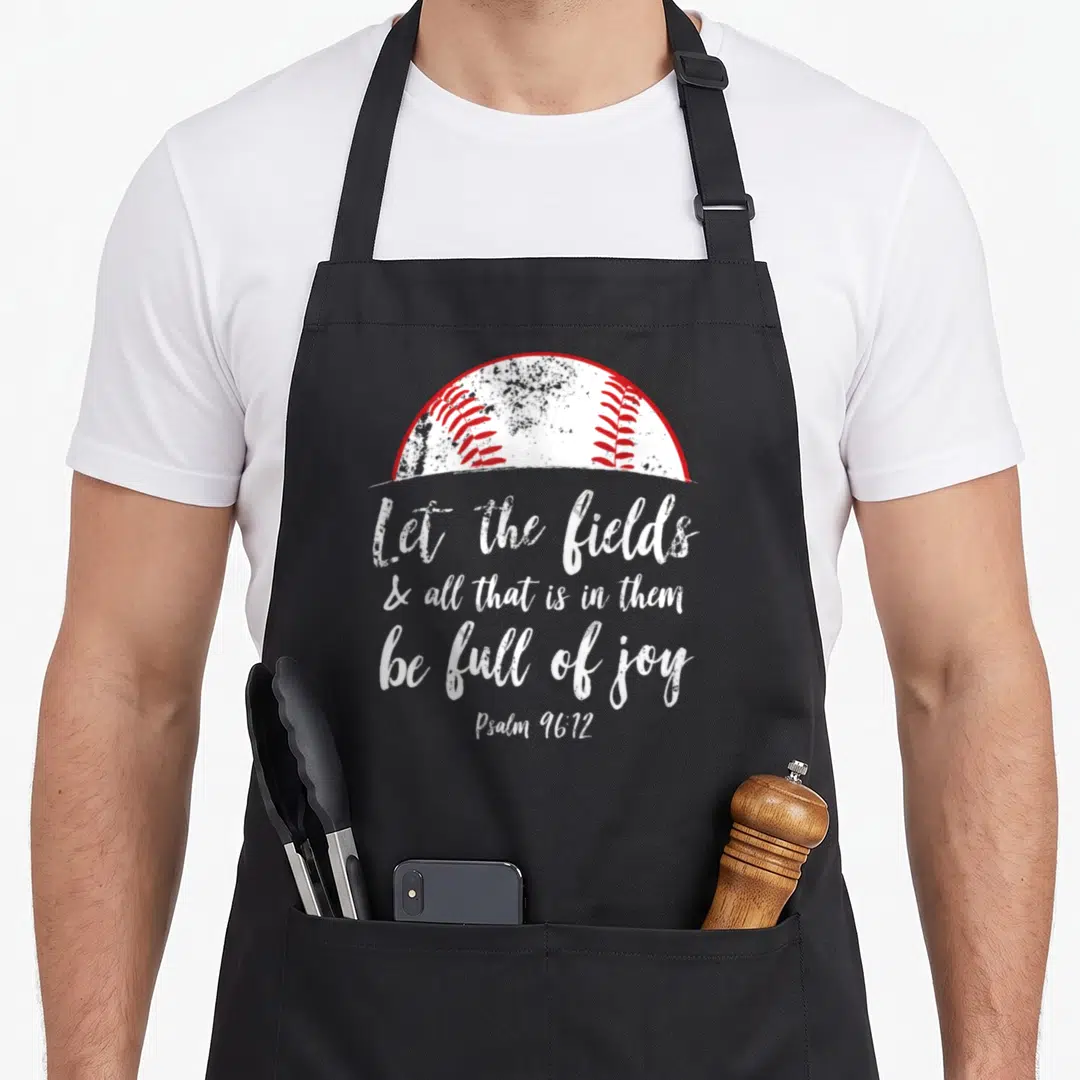 Baseball christian bible verse apron - White and red half-baseball above white script reading Let the fields be full — shown on a black cotton canvas apron against a white background