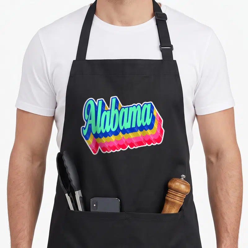 State montgomery alabama apron - Alabama 3D text in blue yellow and pink layers — shown on a black cotton canvas apron against a white background