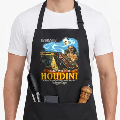 Houdini magic apron - Vintage Houdini poster with sarcophagus, Sphinx, floating head, and Buried Alive text in yellow — shown on a black cotton canvas apron against a white background