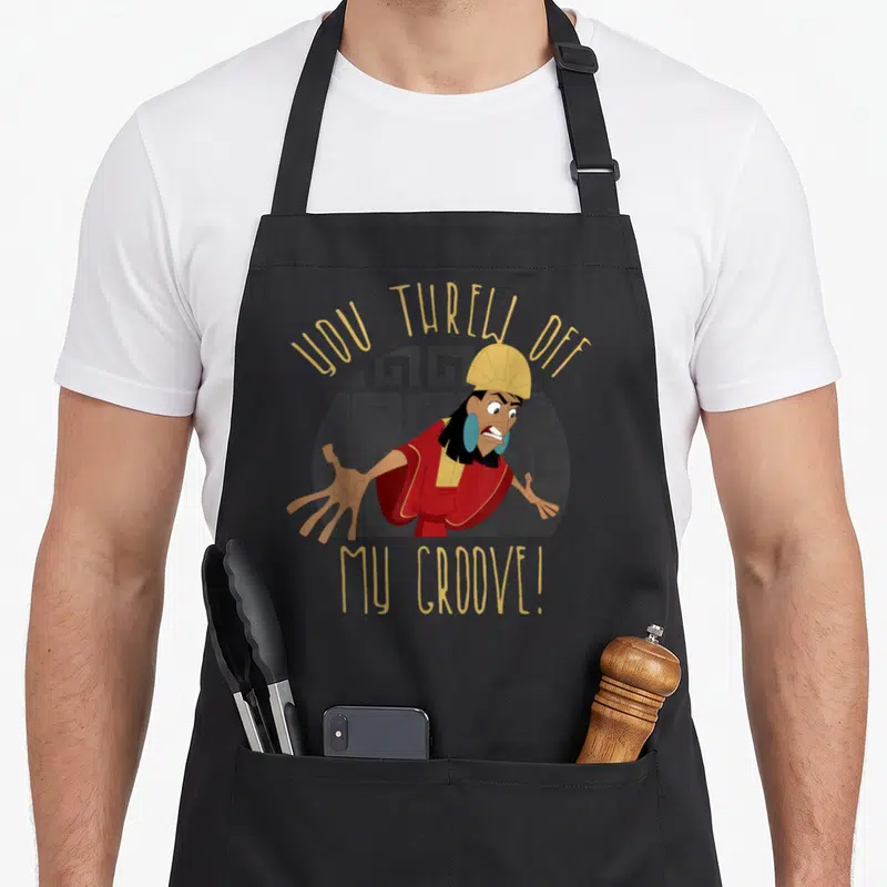 Emperor novelty apron - Cartoon man in red robe with text You Threw Off My Groove over grey greek key circle — shown on a black cotton canvas apron against a white background