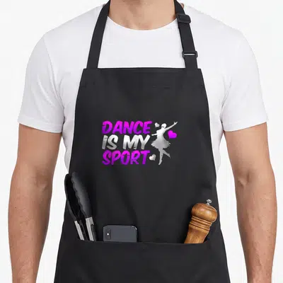 Epic teacher apron - Purple and white stacked text reading Dance Is My Sport beside a dancer silhouette and hearts — shown on a black cotton canvas apron against a white background