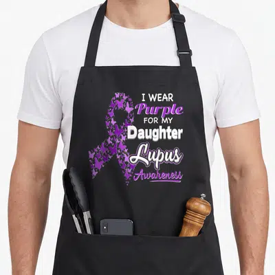 Daughter lupus awareness apron - Purple butterfly awareness ribbon with I WEAR Purple FOR MY Daughter Lupus Awareness — shown on a black cotton canvas apron against a white background