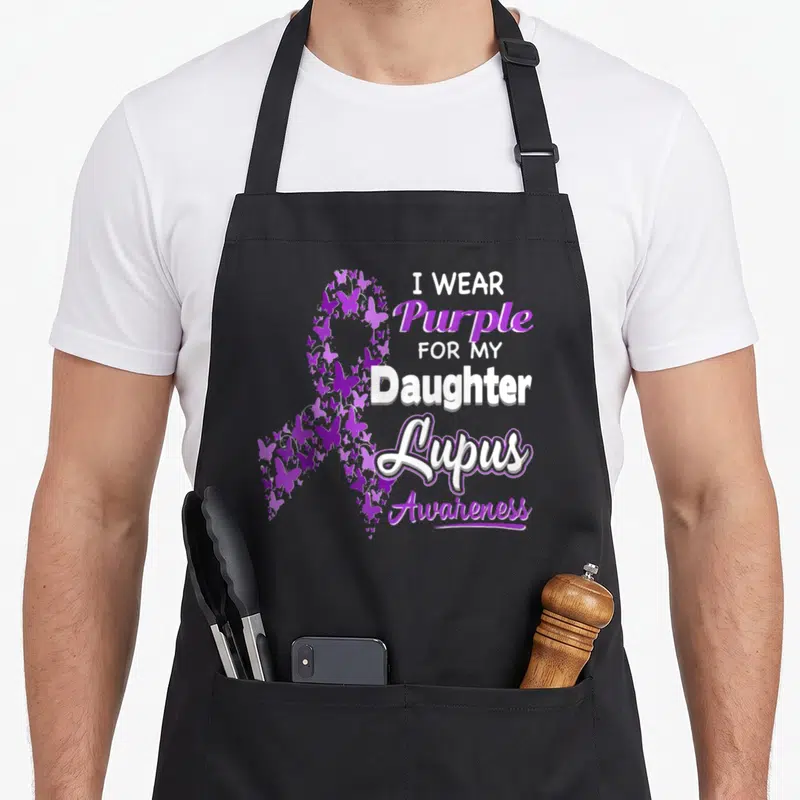 Daughter lupus awareness apron - Purple butterfly awareness ribbon with I WEAR Purple FOR MY Daughter Lupus Awareness — shown on a black cotton canvas apron against a white background