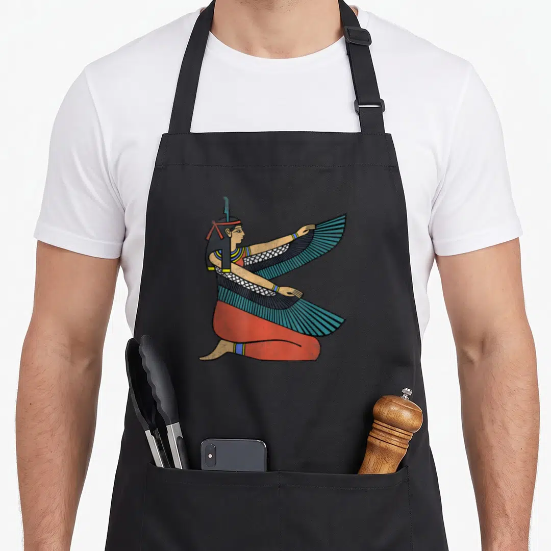 Maat egyptian apron - Winged Egyptian deity kneeling facing right in red blue black tan line art — shown on a black cotton canvas apron against a white background