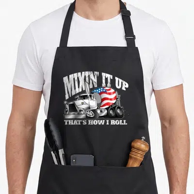 Mixing bricklayer apron - Cement mixer truck with red white and blue flag drum and arched white text — shown on a black cotton canvas apron against a white background