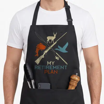Retirement grill hunter apron - Crossed rifle fishing rod deer fish duck MY RETIREMENT PLAN retro beige blue red — shown on a black cotton canvas apron against a white background