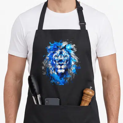 Fan lion apron - Blue watercolor lion head with grey paint splashes and black details — shown on a black cotton canvas apron against a white background