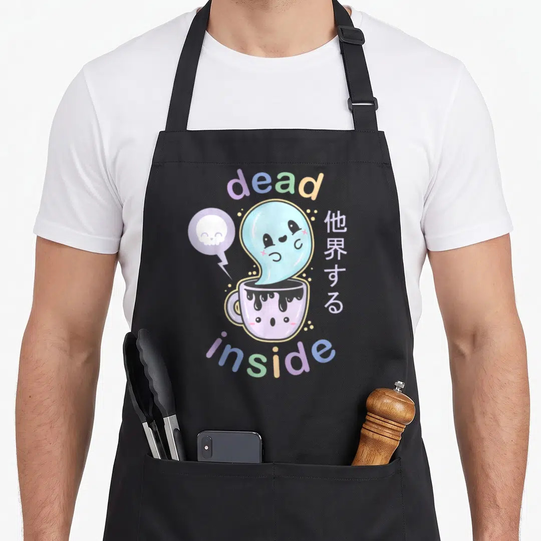 Pastel coffee apron - Ghost rising from purple cup with dead inside text and skull bubble — shown on a black cotton canvas apron against a white background