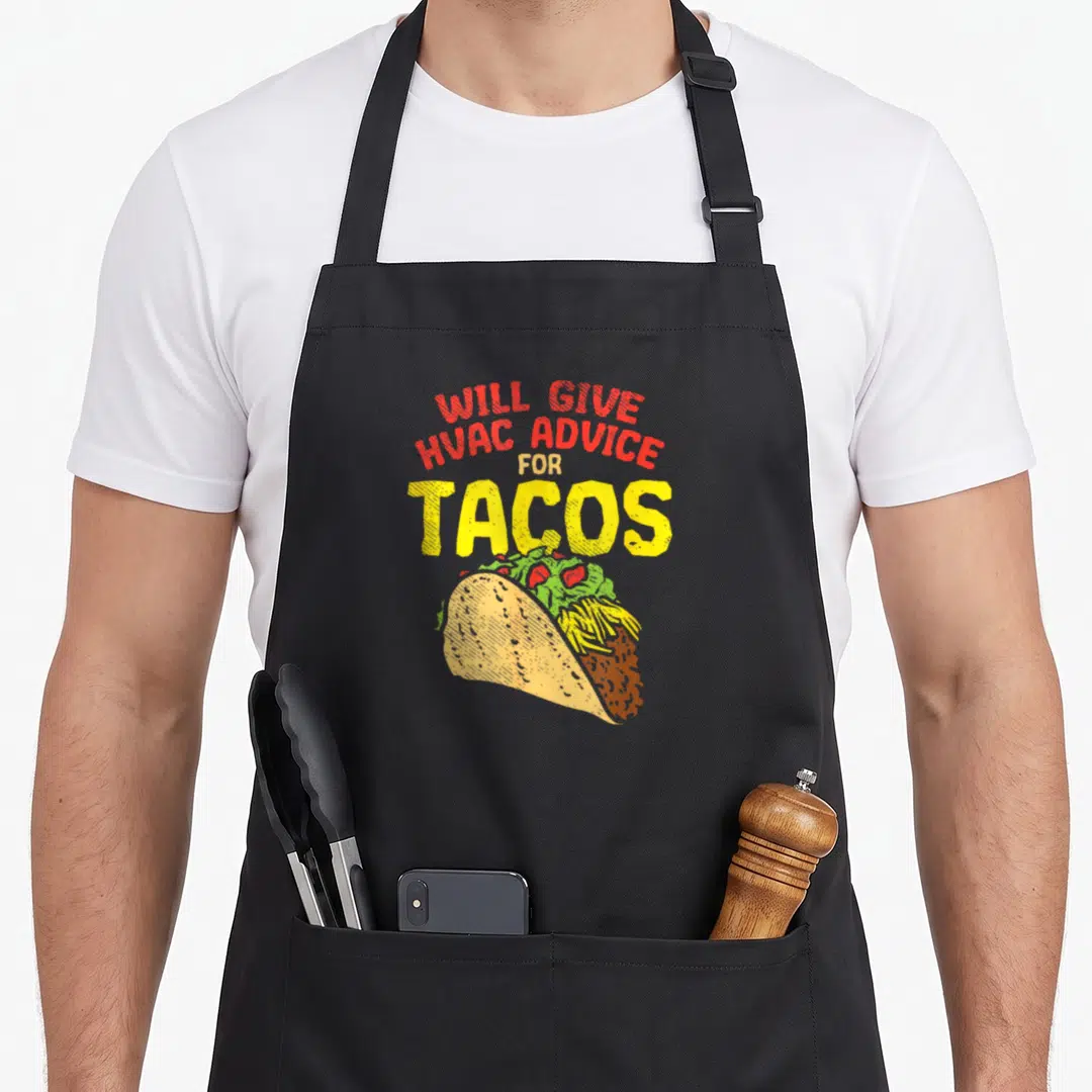 Funny technician hvac tech apron - Will Give HVAC Advice For Tacos text above illustrated taco in red yellow green — shown on a black cotton canvas apron against a white background