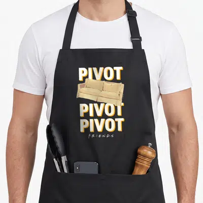 Pivot couch friends apron - Beige sofa centered between three PIVOT words and F.R.I.E.N.D.S logo at bottom — shown on a black cotton canvas apron against a white background