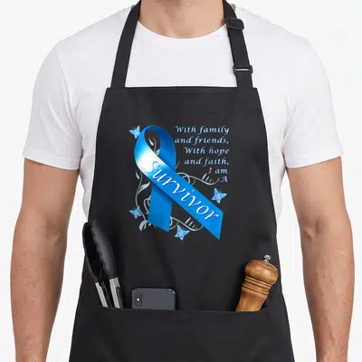 Survivor blue ribbon apron - Blue awareness ribbon with Survivor text and butterfly graphics — shown on a black cotton canvas apron against a white background