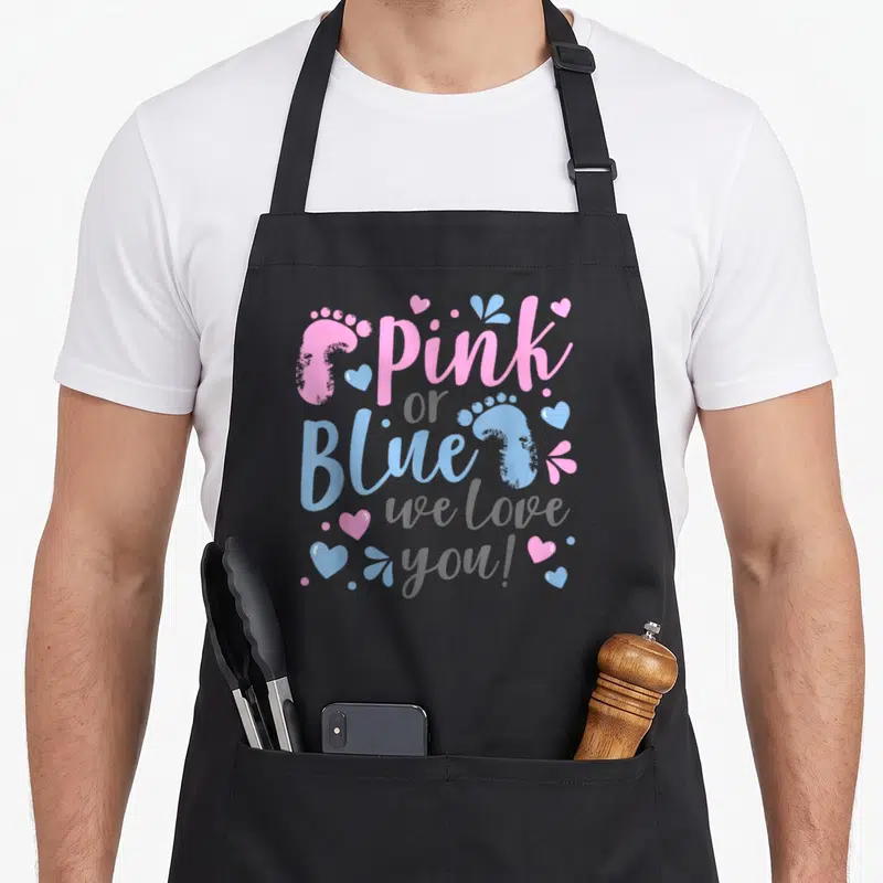 Baby apron or apron - Pink and blue footprint typography with hearts and we love you text on grey background — shown on a black cotton canvas apron against a white background