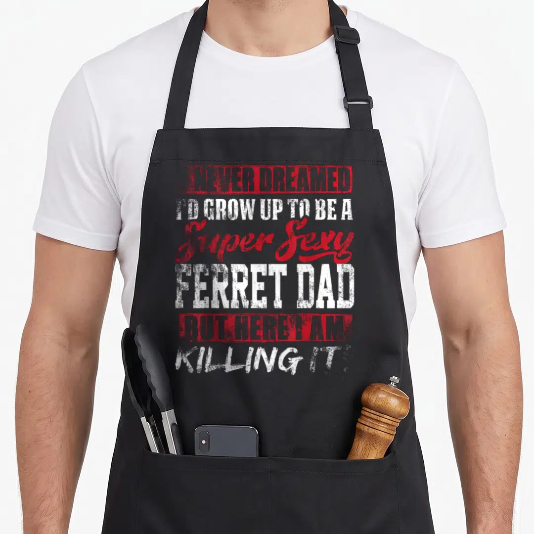 Dreamed ferret dad apron - Red and white stacked typography quote about being a super sexy ferret dad on grey background — shown on a black cotton canvas apron against a white background