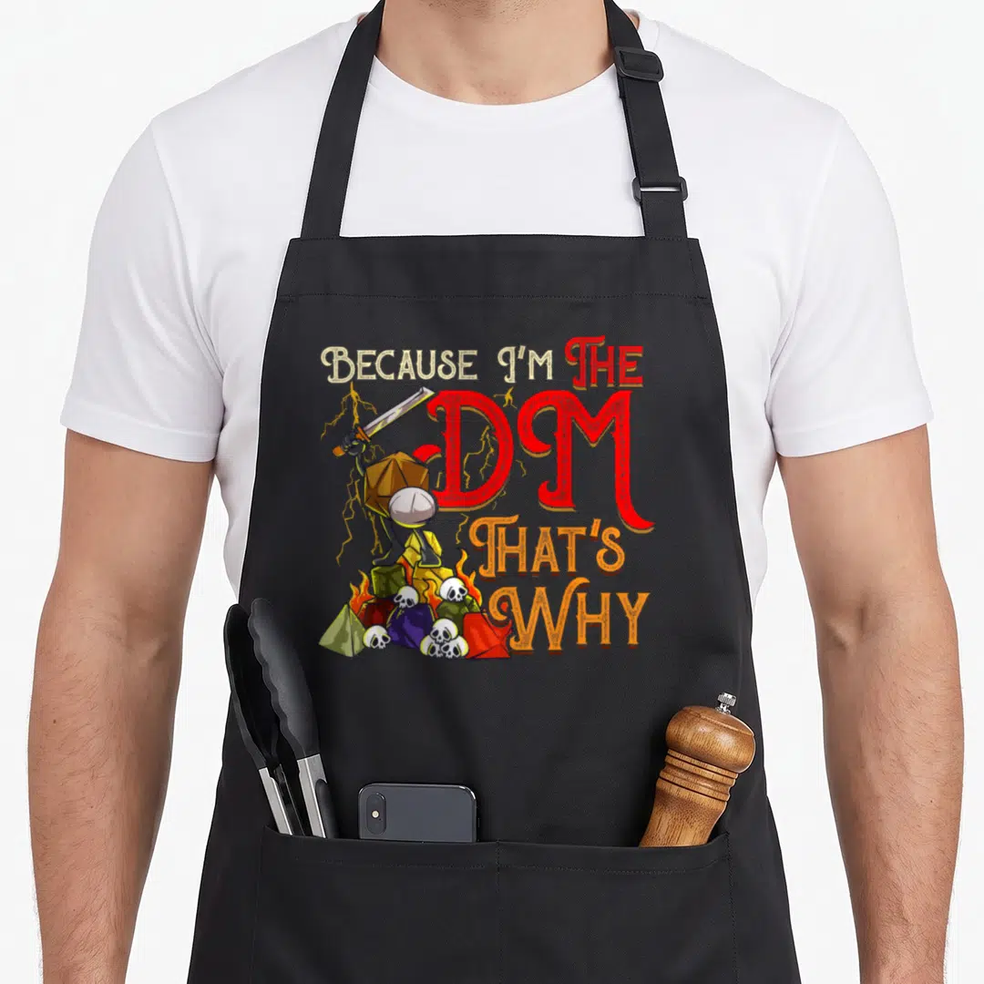 Cool novelty apron for the grill master - d20 character holding sword on dice pile with DM text — shown on a black cotton canvas apron against a white background